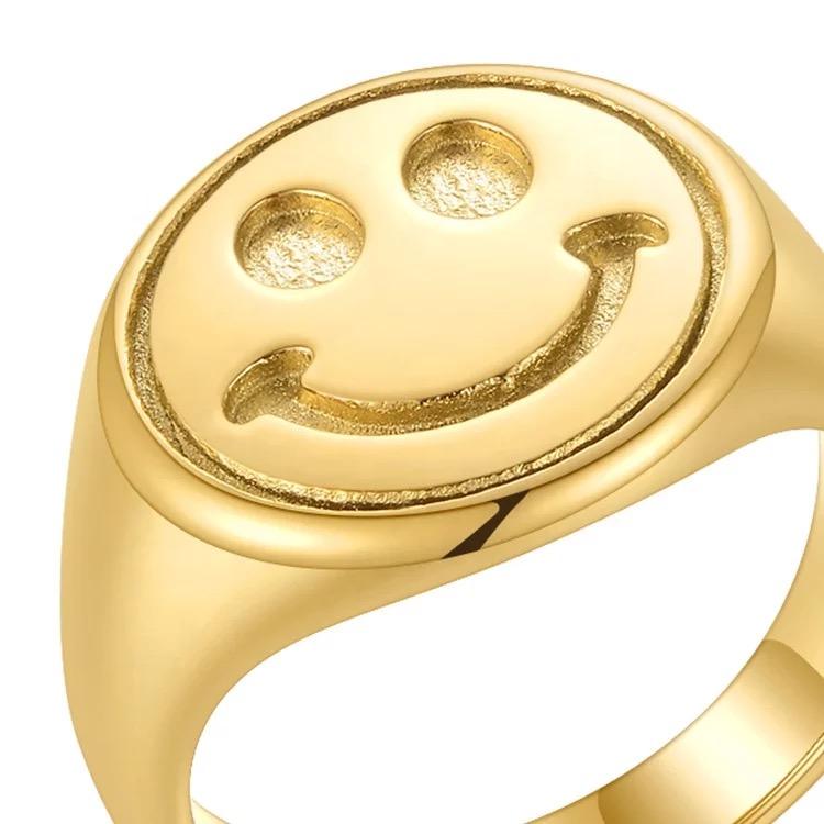 Happy Signet Ring featuring a playful smiley face design in 18 karat gold plating, perfect for adding joy to any outfit.