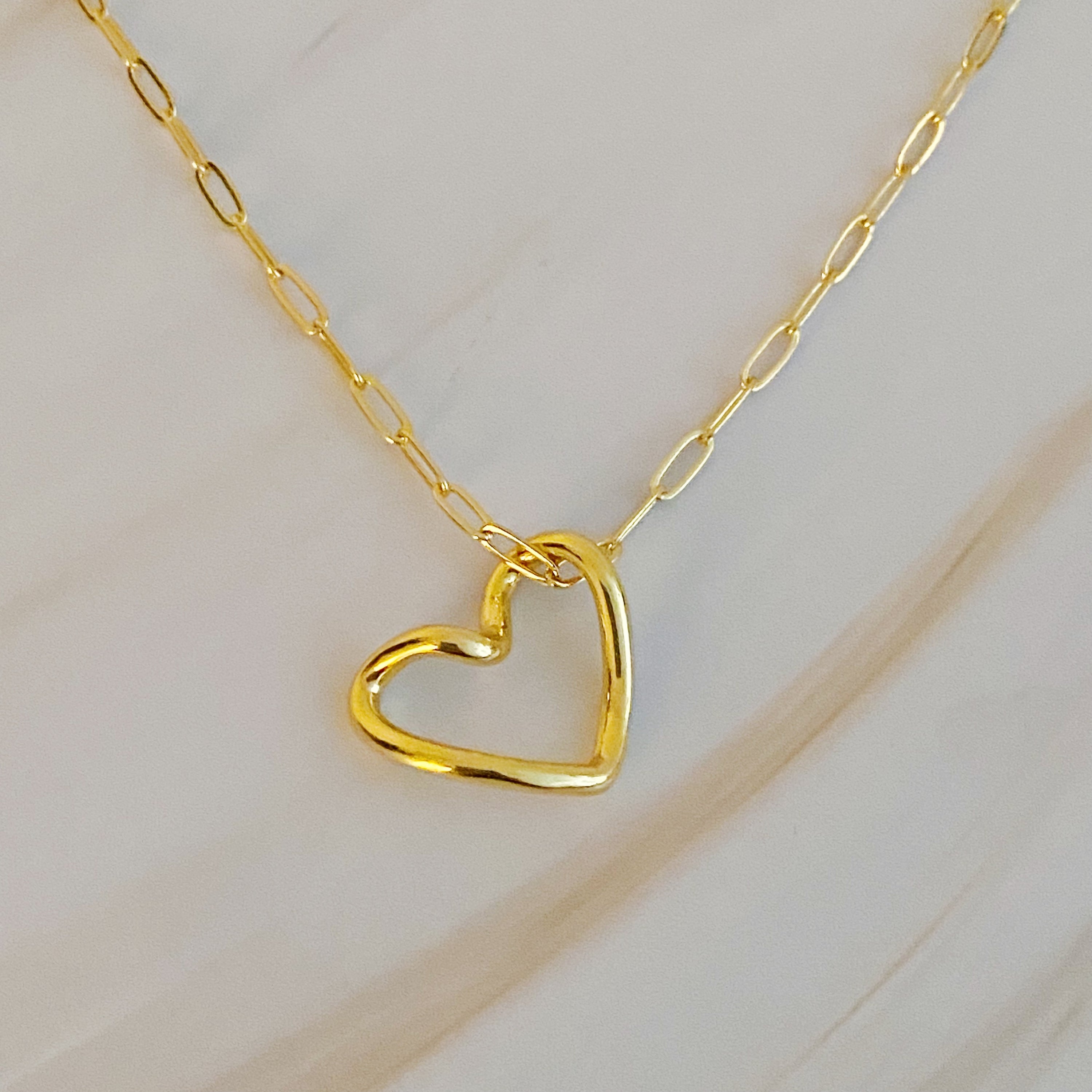 A stylish Heart and Chain Necklace featuring a hip heart pendant on a delicate link chain, perfect for everyday wear.