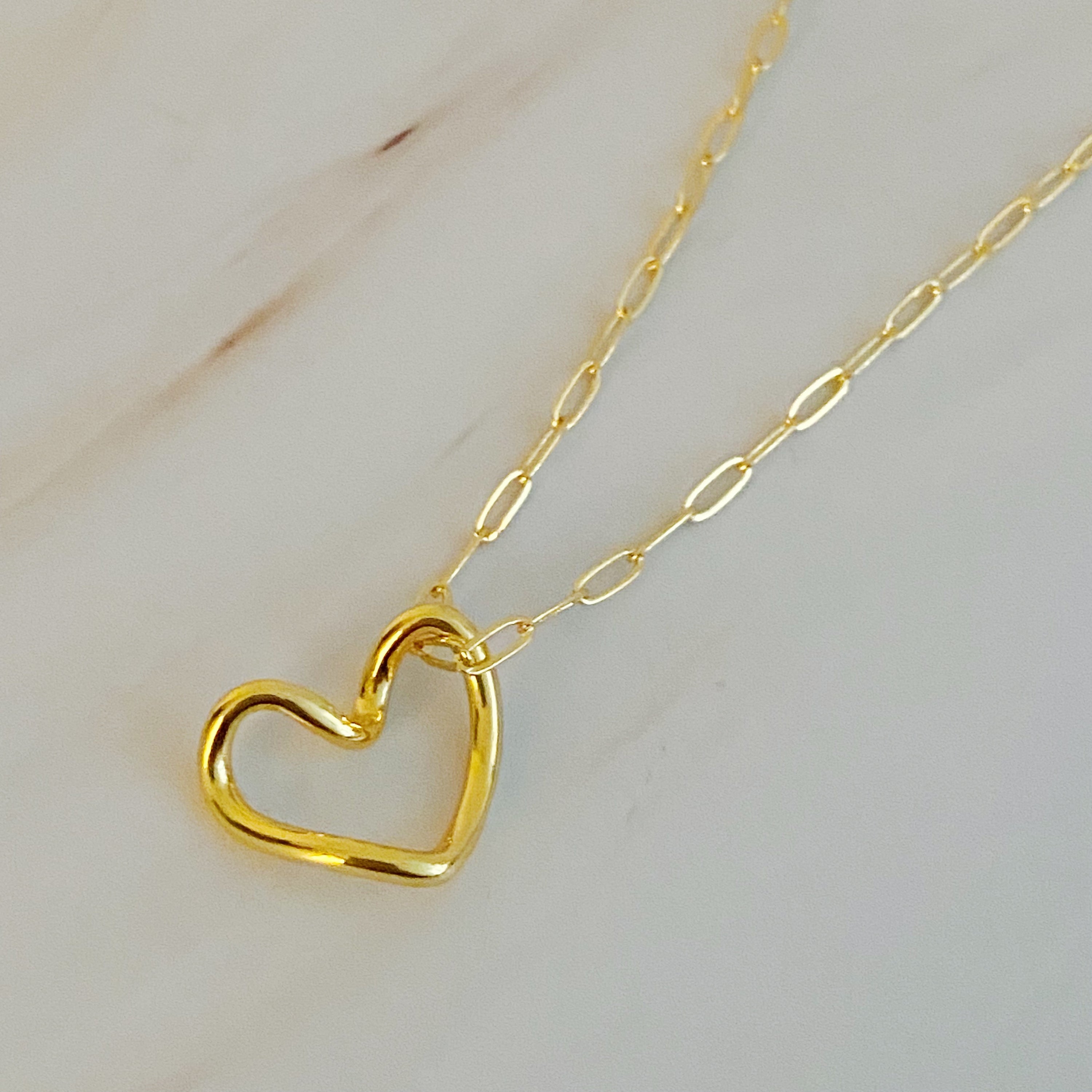 A stylish Heart and Chain Necklace featuring a hip heart pendant on a delicate link chain, perfect for everyday wear.