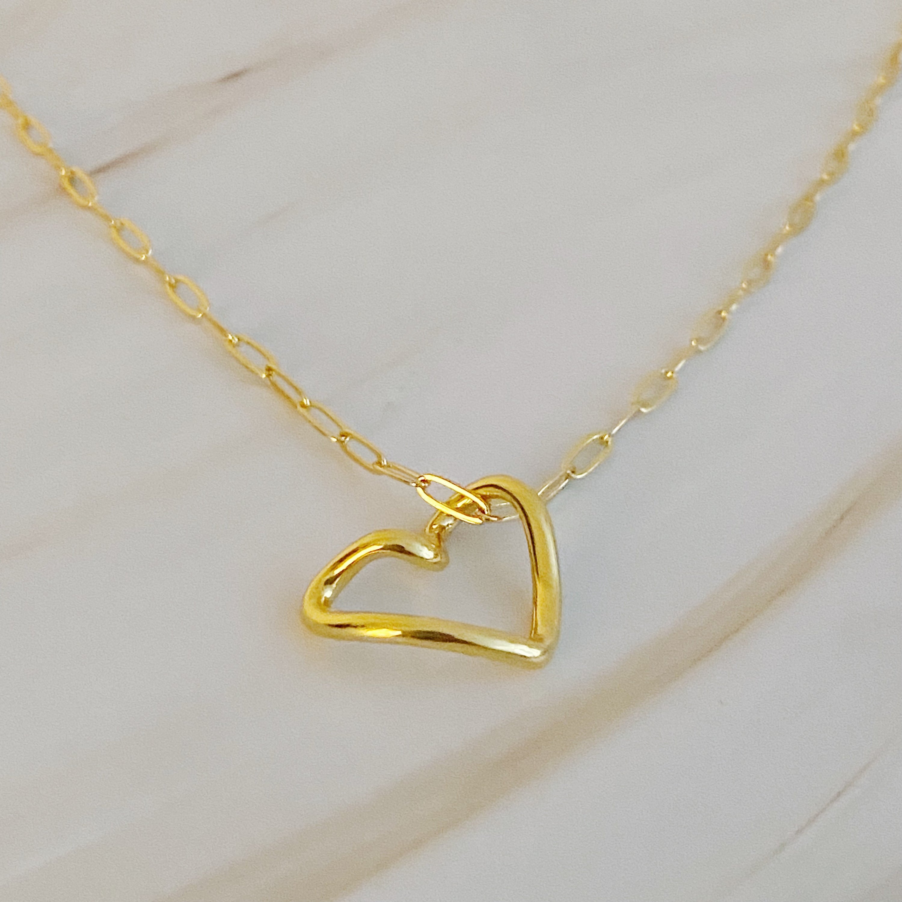 A stylish Heart and Chain Necklace featuring a hip heart pendant on a delicate link chain, perfect for everyday wear.