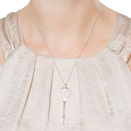 Elegant Heart and Key Necklace in 925 sterling silver, featuring a heart and key pendant on an 18-inch chain.