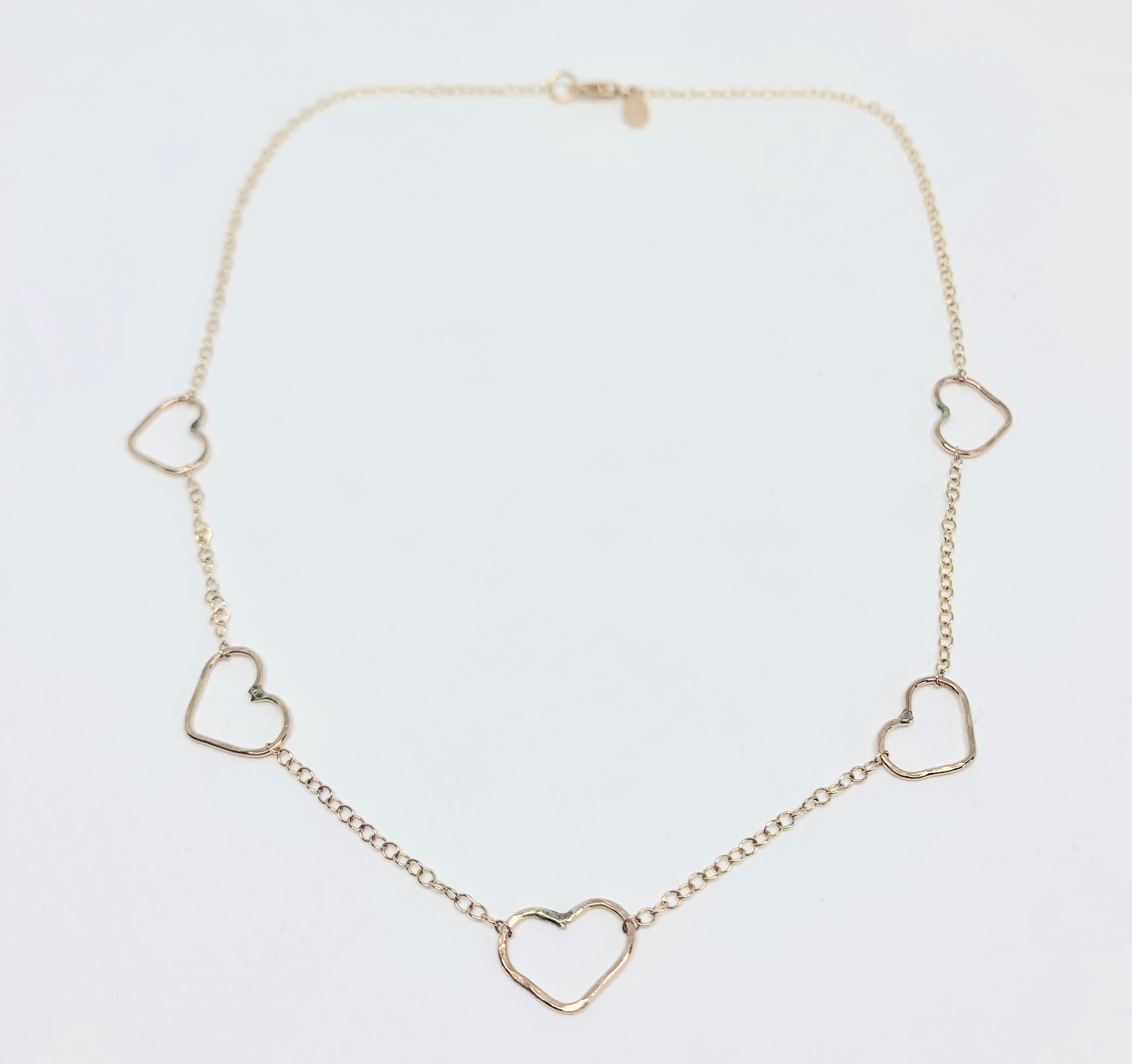 Handmade Heart Choker Necklace in sterling silver, rose gold fill, and yellow gold fill with textured hammered hearts.