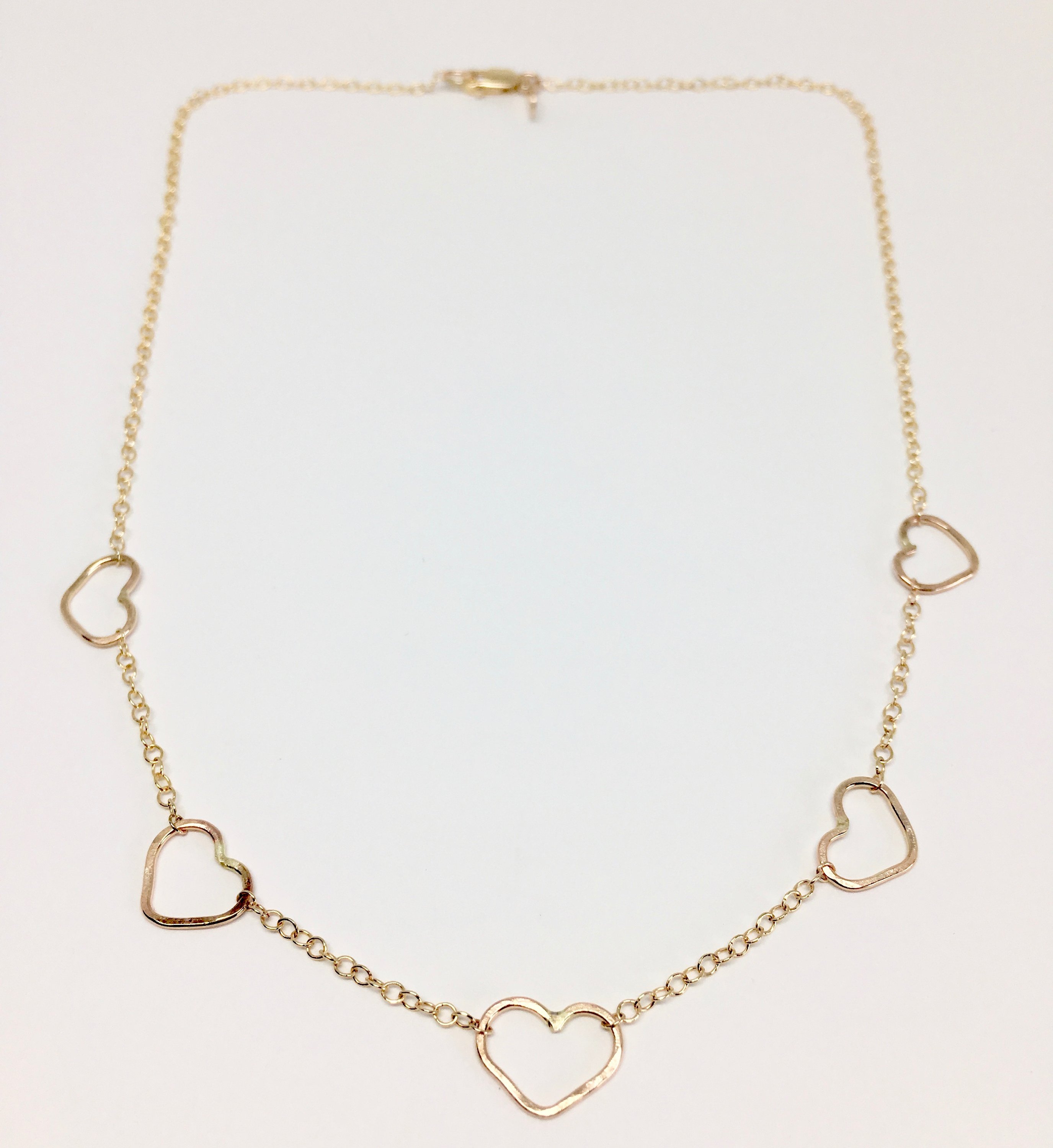 Handmade Heart Choker Necklace in sterling silver, rose gold fill, and yellow gold fill with textured hammered hearts.