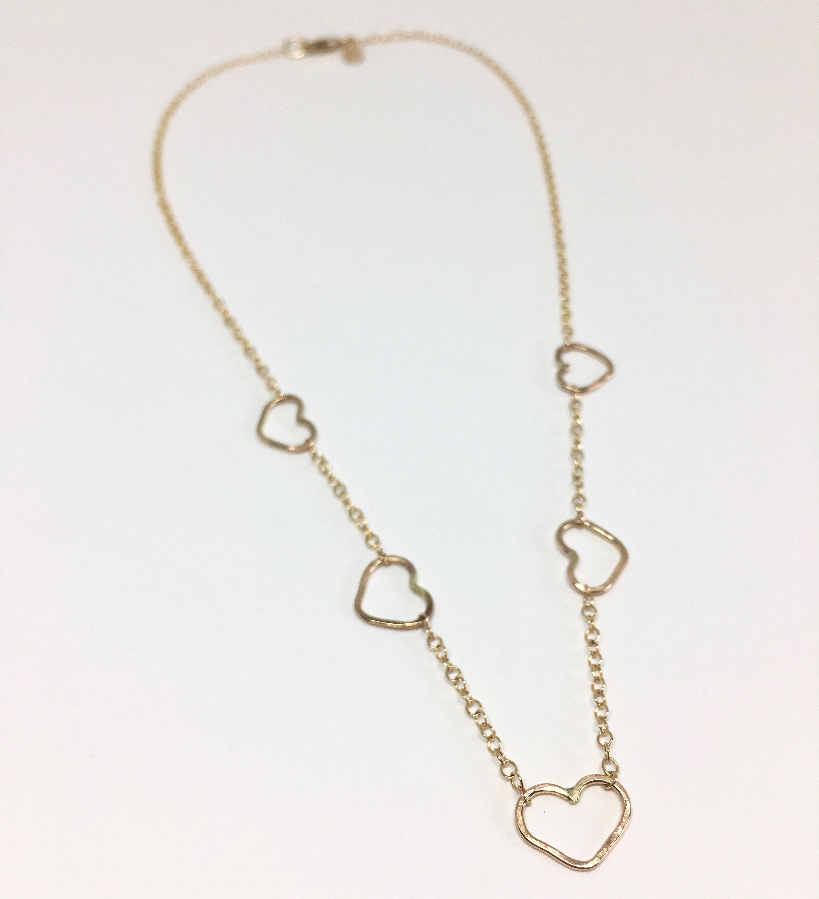 Handmade Heart Choker Necklace in sterling silver, rose gold fill, and yellow gold fill with textured hammered hearts.