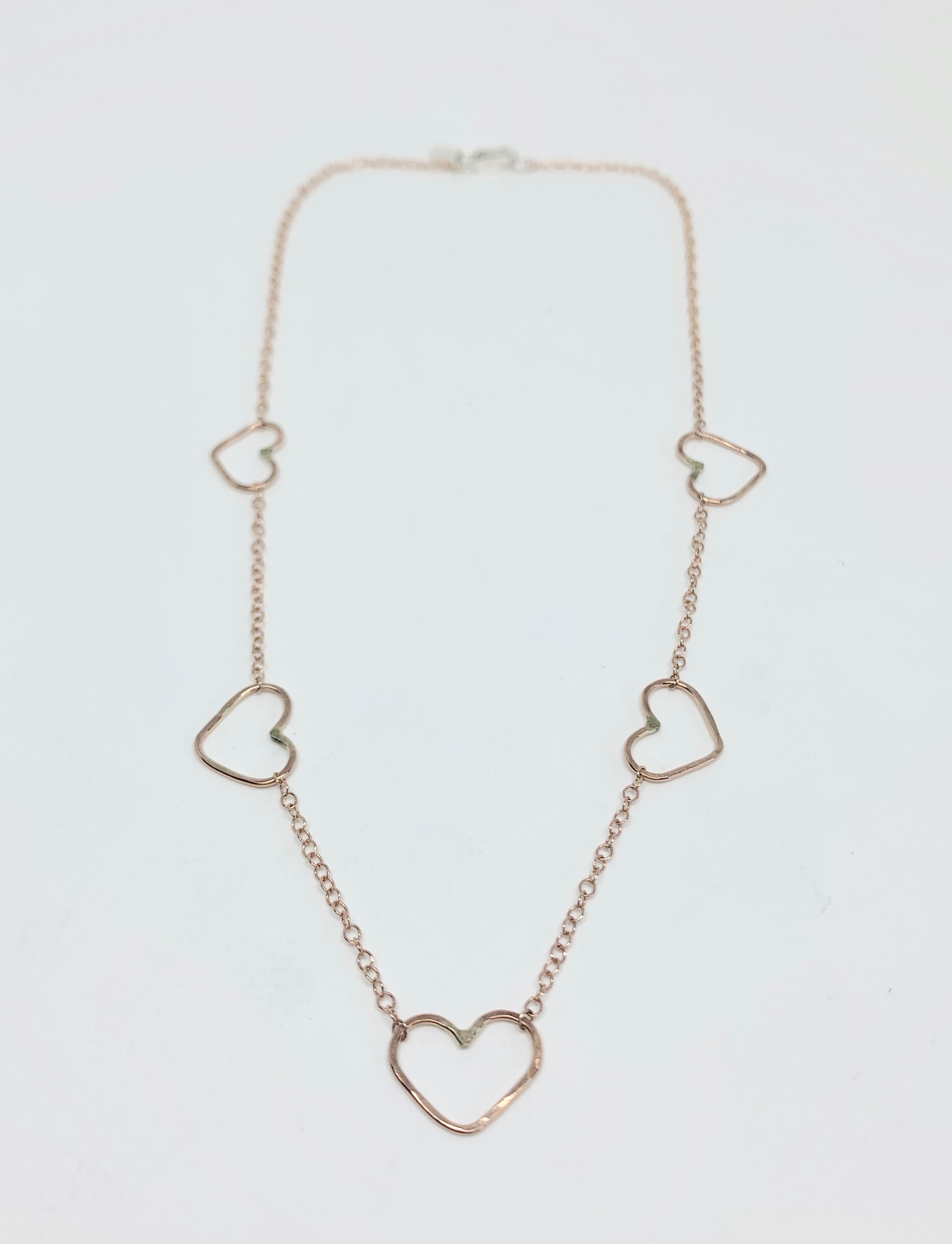 Handmade Heart Choker Necklace in sterling silver, rose gold fill, and yellow gold fill with textured hammered hearts.