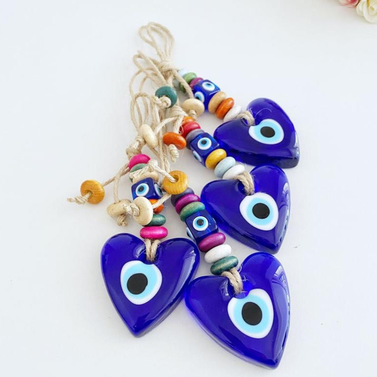 Heart Evil Eye Wall Hanging featuring glass beads and macrame design, perfect for home decor and protection.