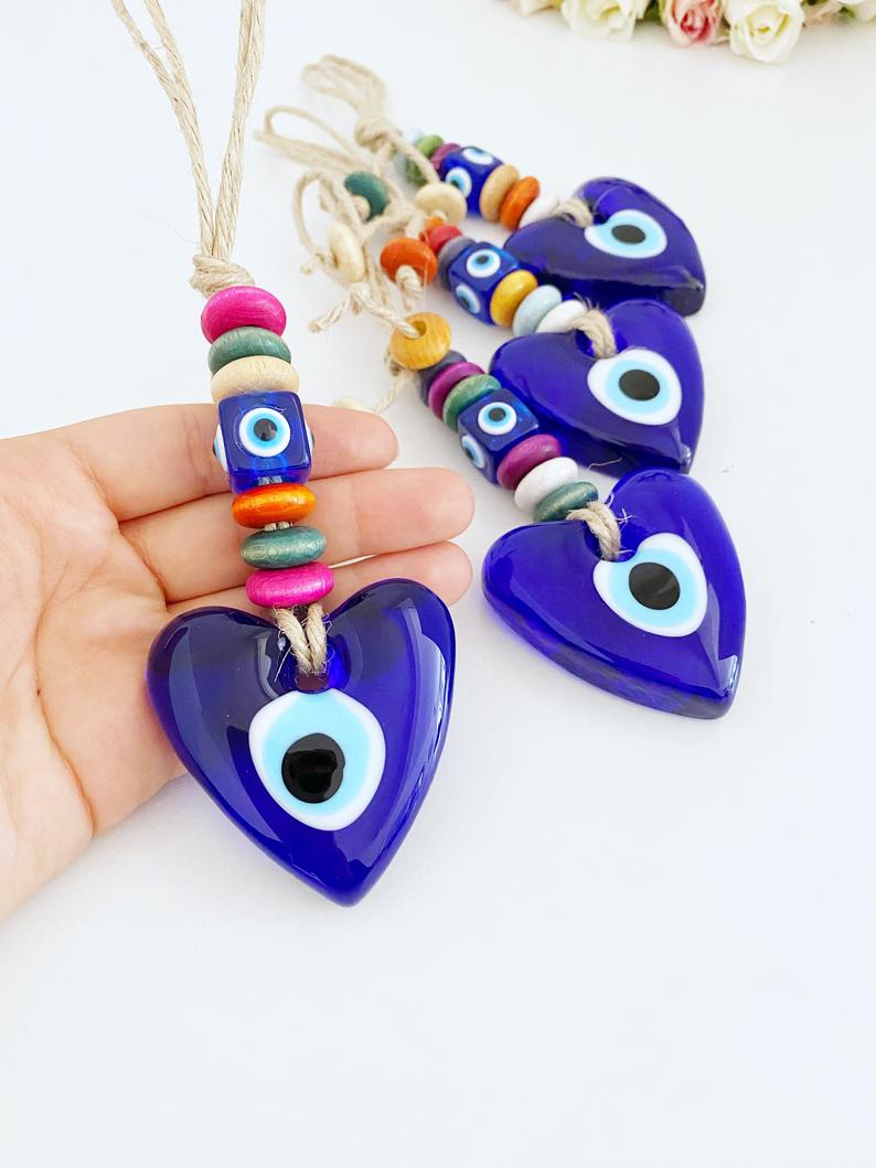 Heart Evil Eye Wall Hanging featuring glass beads and macrame design, perfect for home decor and protection.