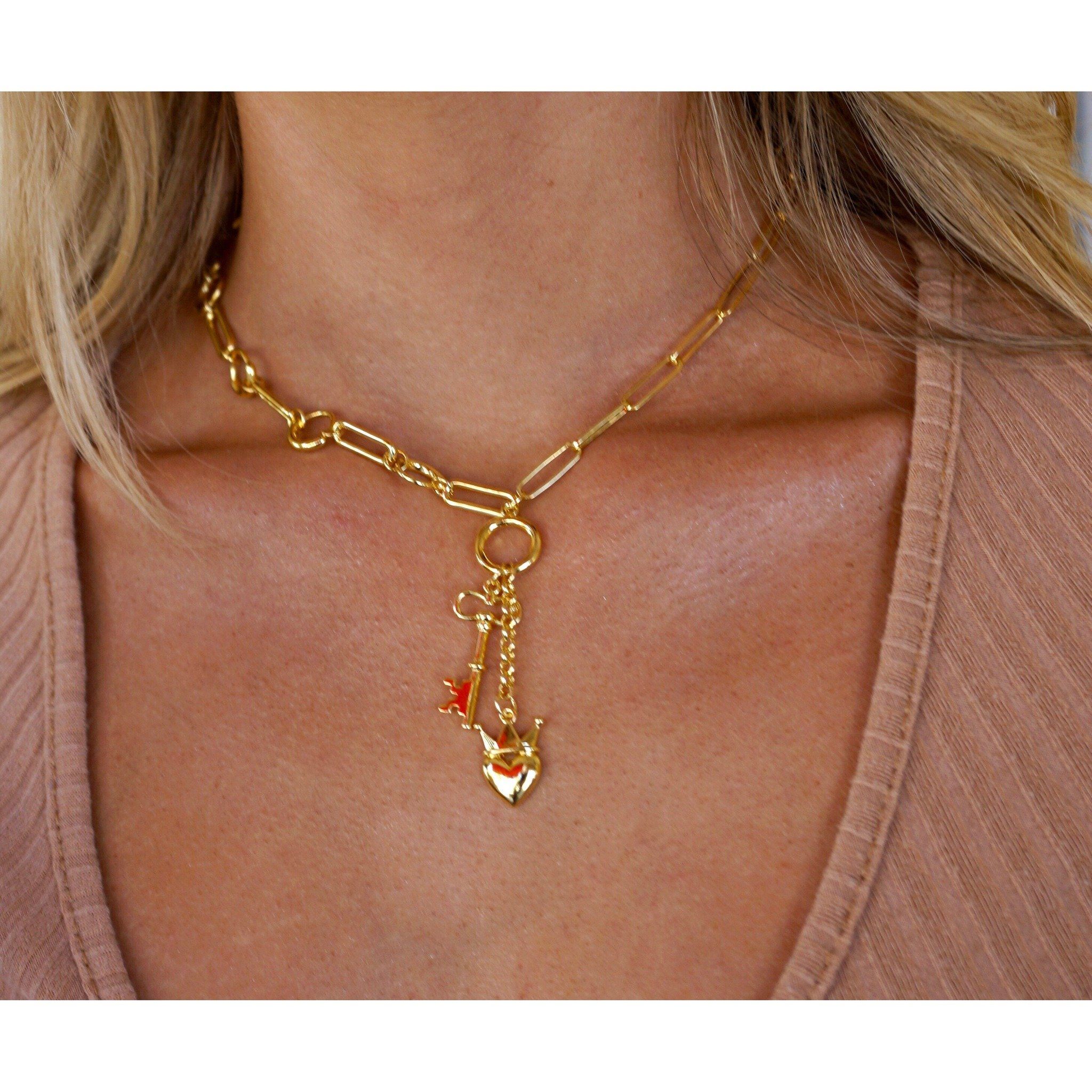 A beautiful Heart Locked Lariat necklace made of 14k gold filled and sterling silver, featuring an elegant heart design.