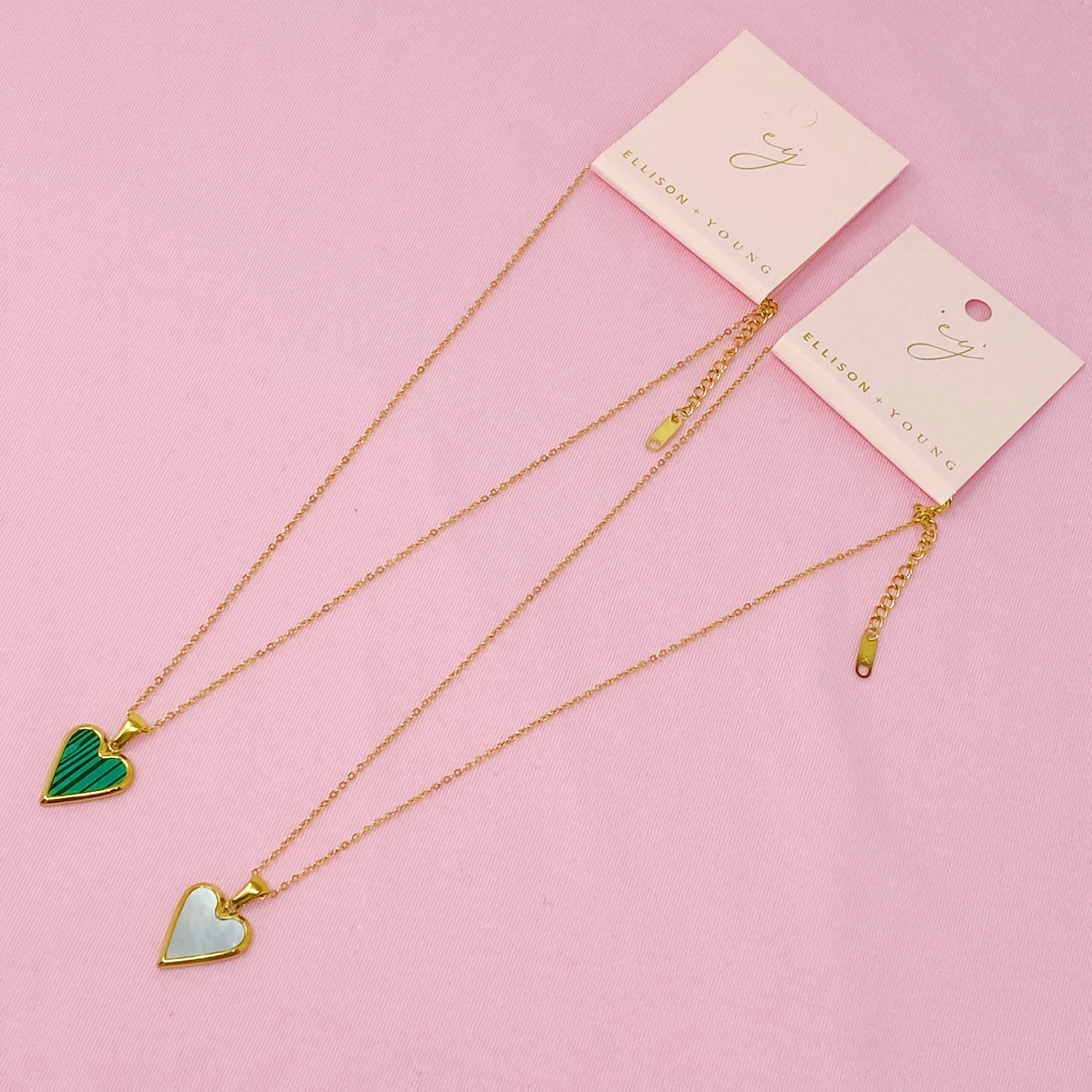 Heart Of Gold Necklace featuring a dainty gold chain and an enamel heart pendant, showcasing elegance and charm.