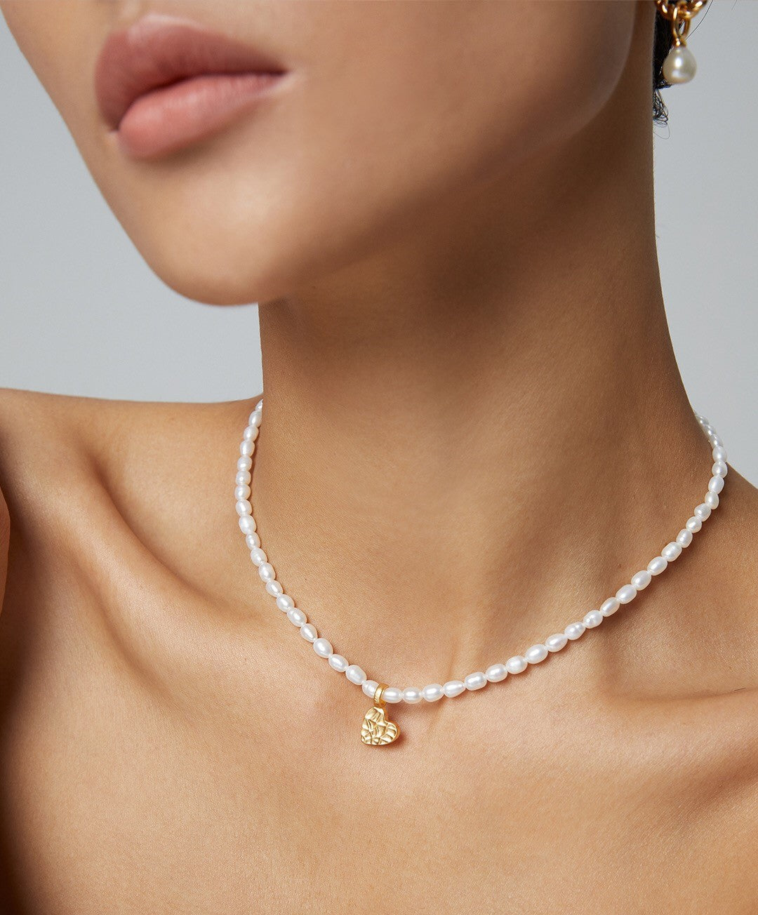 Elegant Heart Pearl Necklace featuring natural pearls and sterling silver, beautifully handcrafted for a timeless accessory.