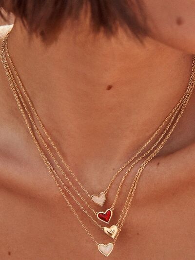 A beautiful heart pendant necklace made of copper and 14K gold-plated, showcasing its elegant design and craftsmanship.