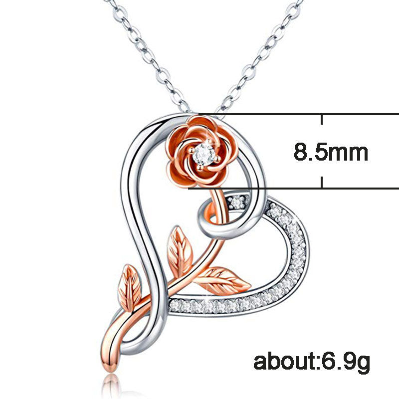 A silver plated heart pendant necklace featuring a rose flower design and sparkling zircon stones on a link chain.