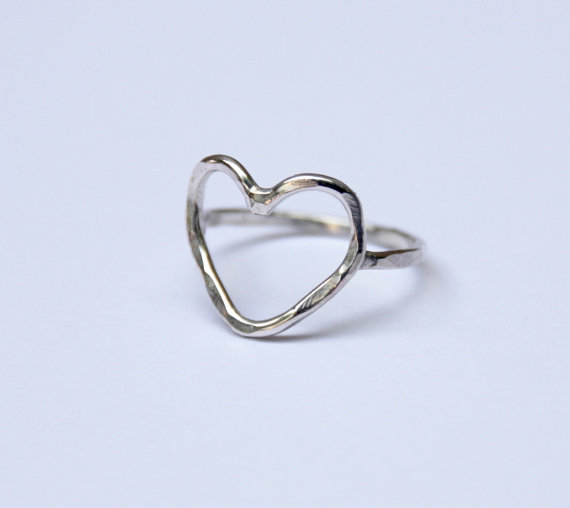 A handcrafted Heart Ring with a rustic hammered texture, made from recycled metals, showcasing its lightweight and elegant design.