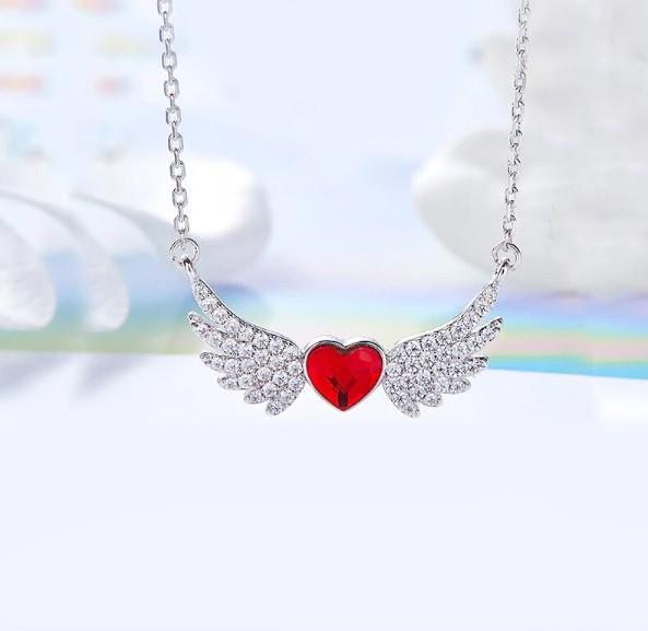 Heart Shaped Angel Wings Necklace in 14K white gold plating with red Elements stones, featuring a delicate heart-shaped pendant and link chain.