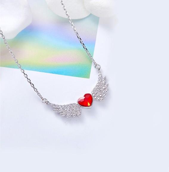 Heart Shaped Angel Wings Necklace in 14K white gold plating with red Elements stones, featuring a delicate heart-shaped pendant and link chain.