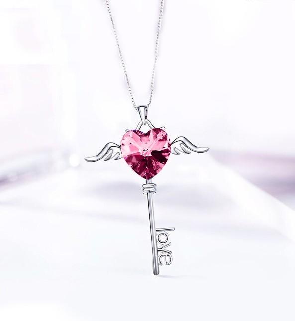 Heart shaped pink elements dangling key necklace in 14K white gold, featuring a delicate link chain and lobster clasp.