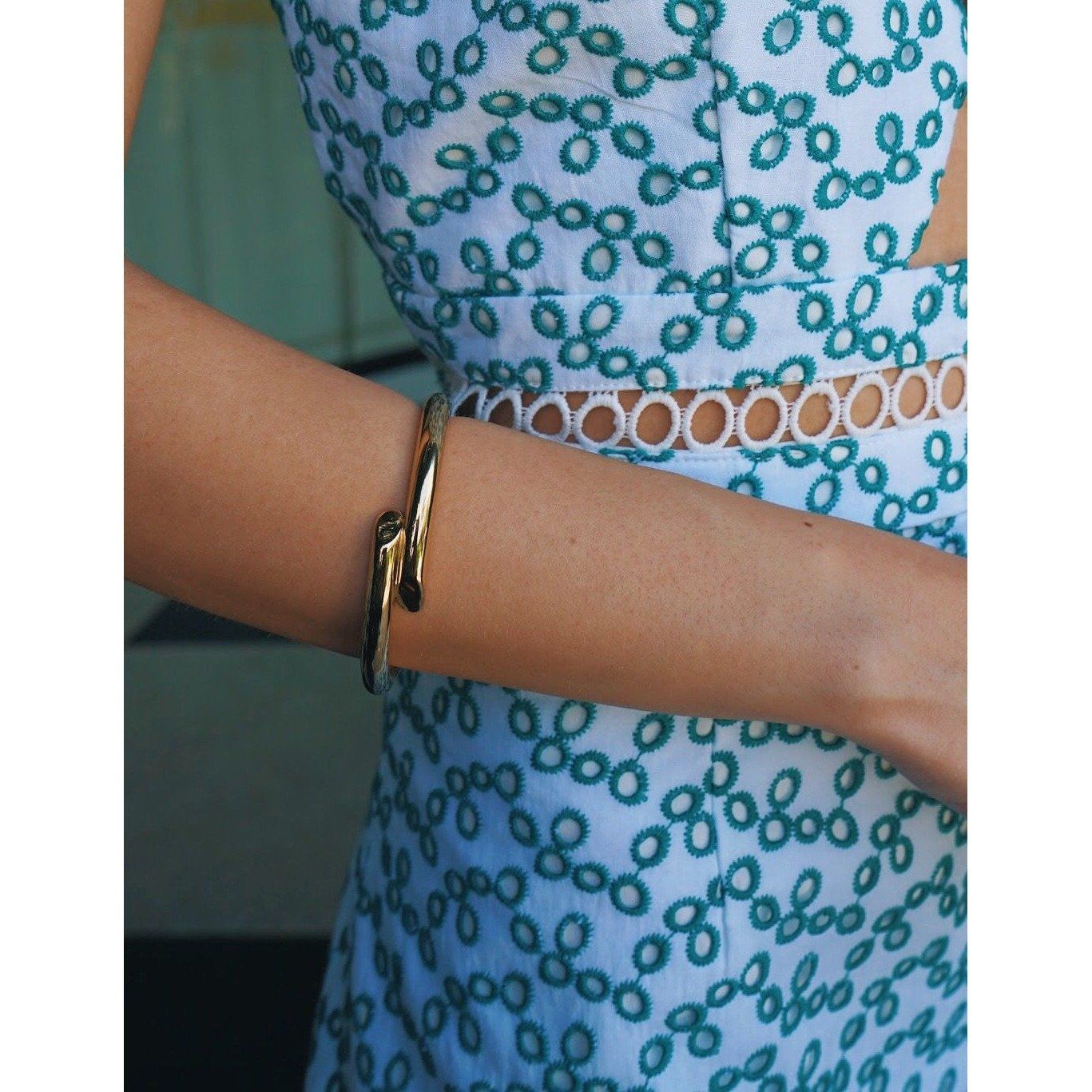 Helen Cuff, a gold-plated stainless steel bracelet, elegantly designed for layering with other bracelets.