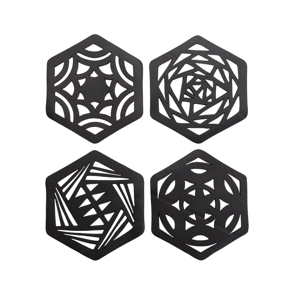 A set of two hexagon-shaped coasters made from recycled rubber, showcasing unique designs and textures.