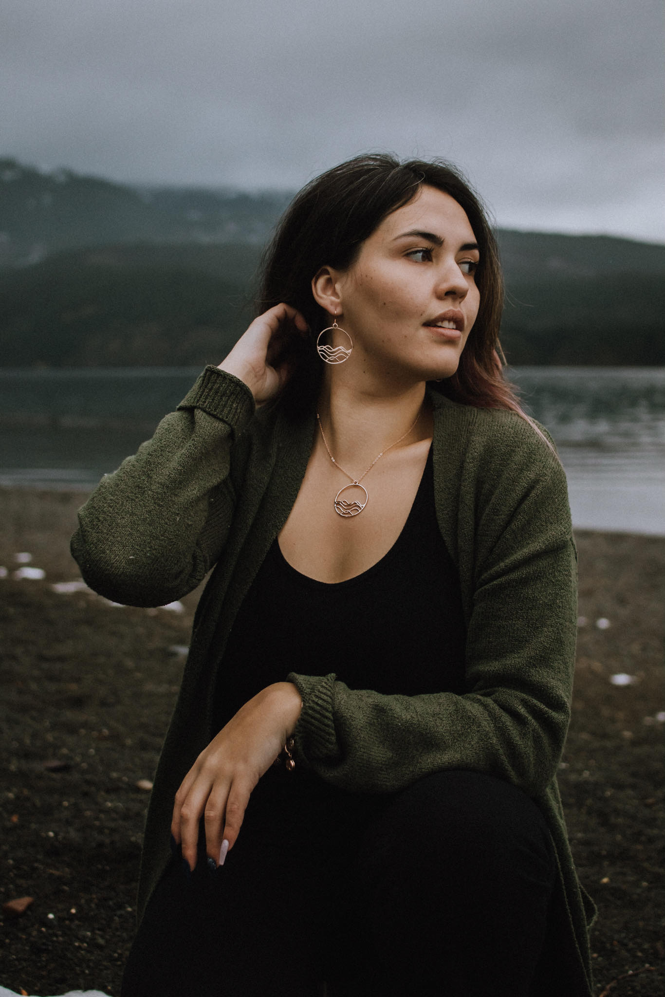 High Tide Ocean Wave Pendant in sterling silver, featuring a circular design inspired by ocean waves, displayed with a matching cable chain necklace.