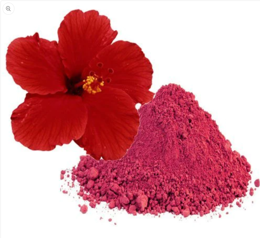 A vibrant red powder made from hibiscus flowers, showcasing its fine texture and natural color.