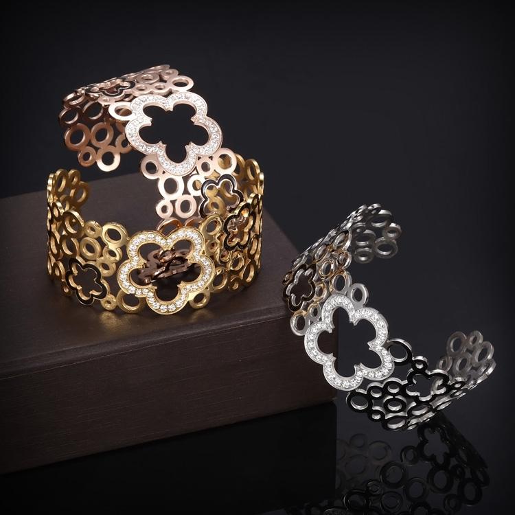 Hollow Clover Wide Cuff Bracelet made of stainless steel with 14K gold plating, featuring a unique clover design.