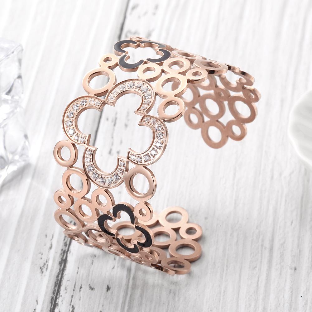 Hollow Clover Wide Cuff Bracelet made of stainless steel with 14K gold plating, featuring a unique clover design.