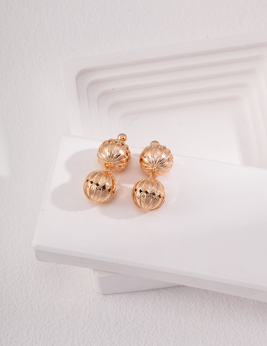 Elegant Hollow Pattern Ball Drop Earrings made of sterling silver and gold vermeil, showcasing a unique design.