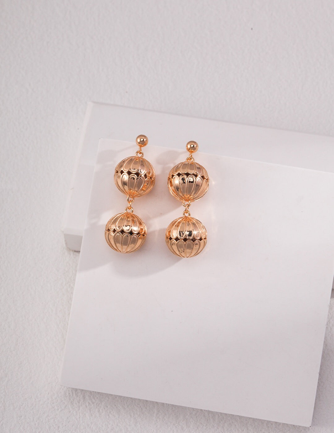 Elegant Hollow Pattern Ball Drop Earrings made of sterling silver and gold vermeil, showcasing a unique design.