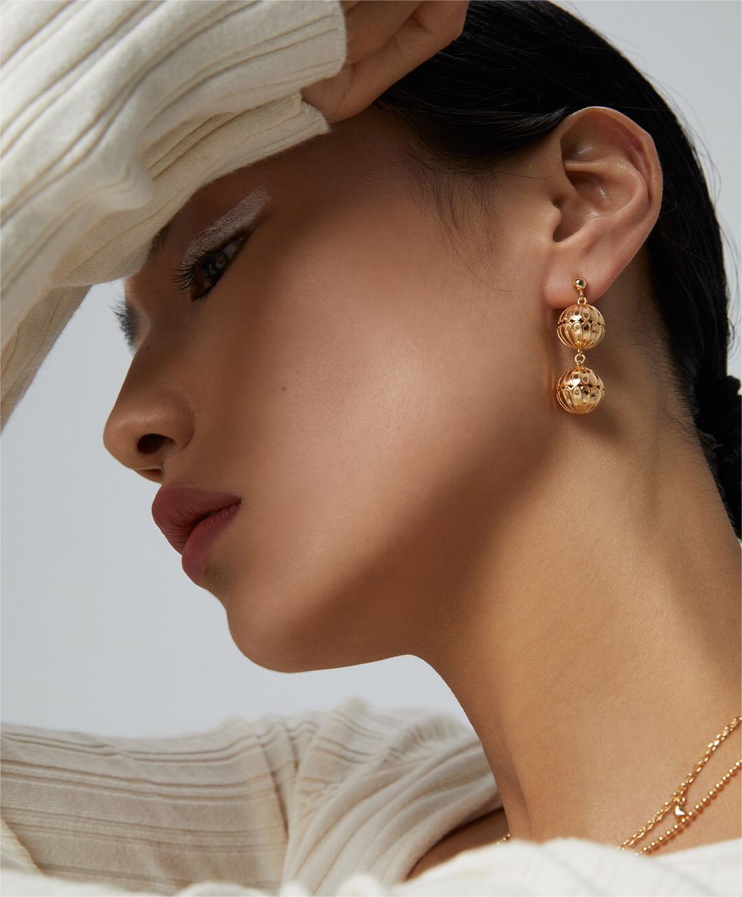 Elegant Hollow Pattern Ball Drop Earrings made of sterling silver and gold vermeil, showcasing a unique design.