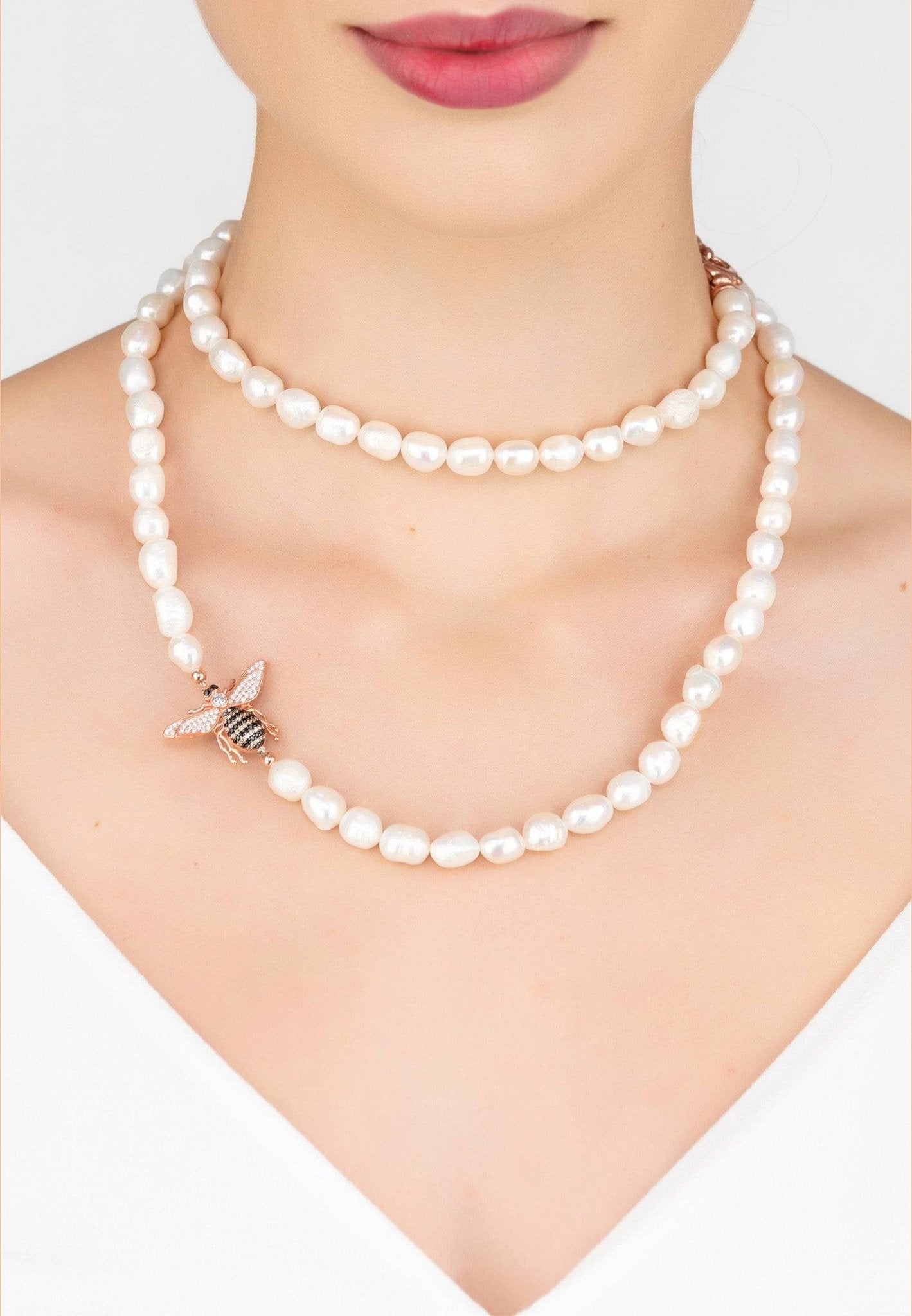 Honey Bee Pearl Gemstone Long Necklace in Rosegold featuring a bee motif and natural pearls, elegantly displayed in a jewellery box.