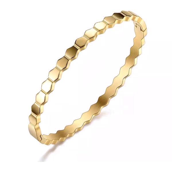 A stylish 18k gold plated honeycomb bracelet made of stainless steel, showcasing a unique honeycomb pattern.