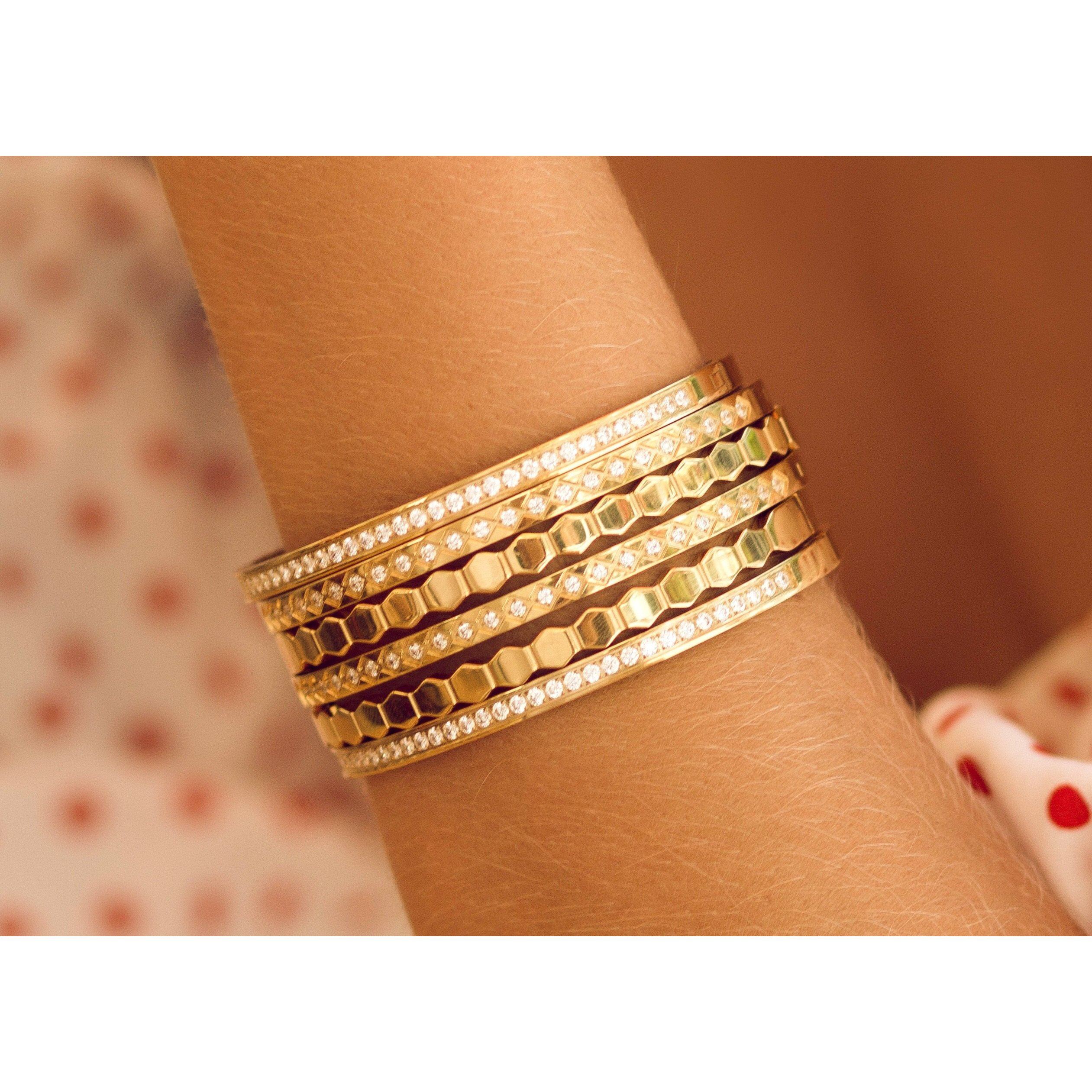 A stylish 18k gold plated honeycomb bracelet made of stainless steel, showcasing a unique honeycomb pattern.