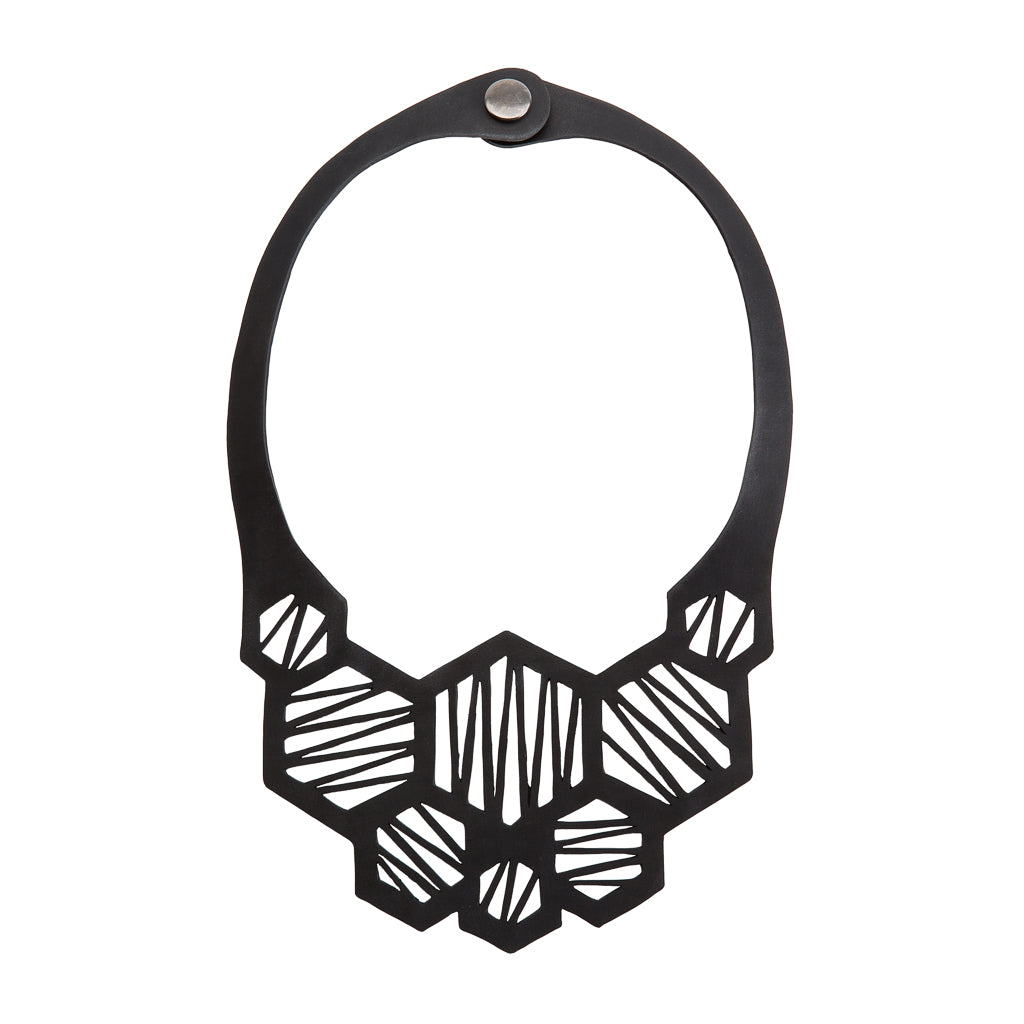 Honeycomb Recycled Rubber Necklace showcasing unique hexagonal design made from reclaimed tyre inner tubes, displayed elegantly in a luxury gift box.