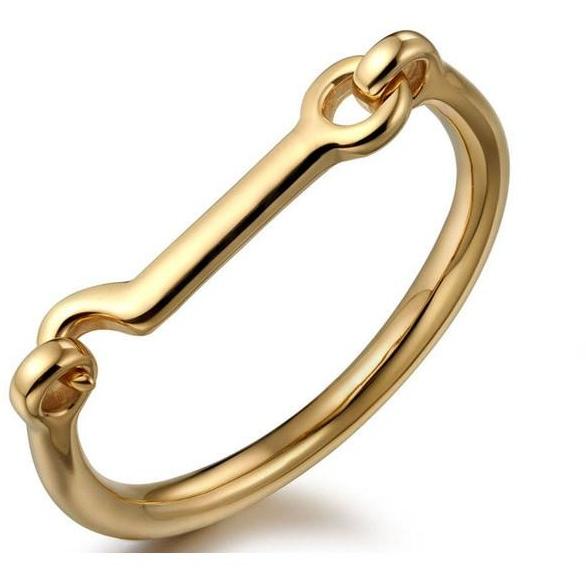 A stylish 14k gold plated horsebit bangle, showcasing its elegant design and shiny finish.