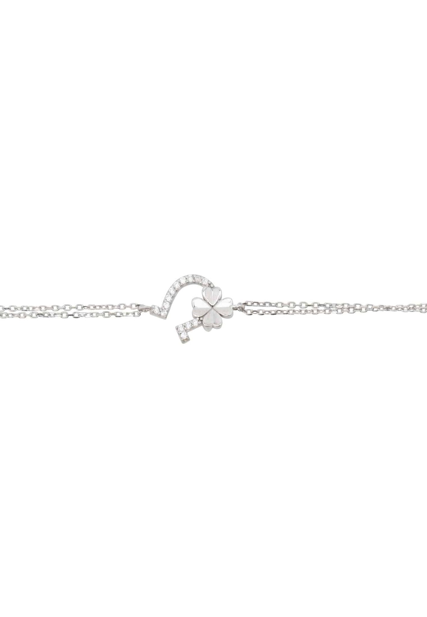 Elegant silver bracelet featuring horseshoe and shamrock motifs, adorned with white zirconia.