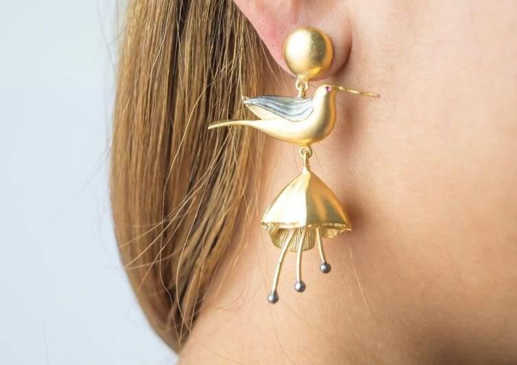 A pair of elegant gold-plated hummingbird earrings, showcasing intricate design and lightweight structure, perfect for any occasion.