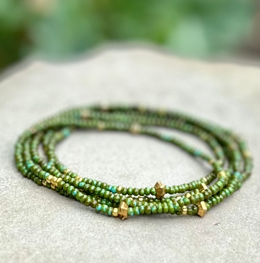 Hunter Green & Gold-Sprinkle Beaded Boho Wrap Bracelet featuring dark green Czech glass beads and metallic gold accents, elegantly wrapped around a wrist.