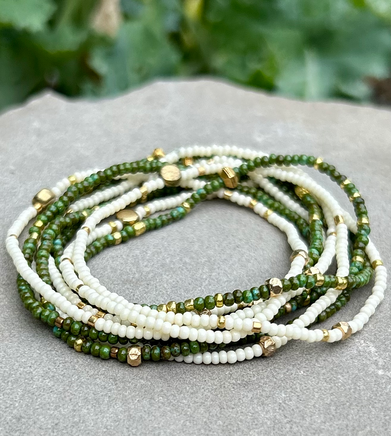 Hunter Green & Gold-Sprinkle Beaded Boho Wrap Bracelet featuring dark green Czech glass beads and metallic gold accents, elegantly wrapped around a wrist.