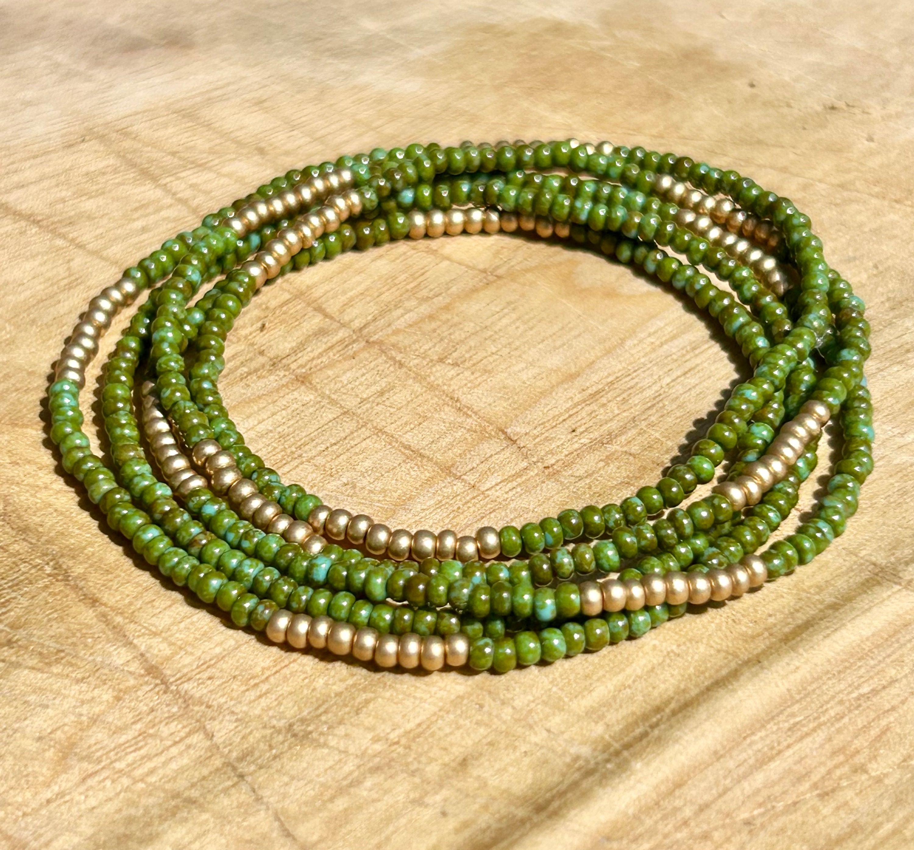 Hunter Green Gold-Striped Beaded 5-Wrap Bracelet featuring Czech glass seed beads and metallic gold accents, elegantly wrapped around a wrist.