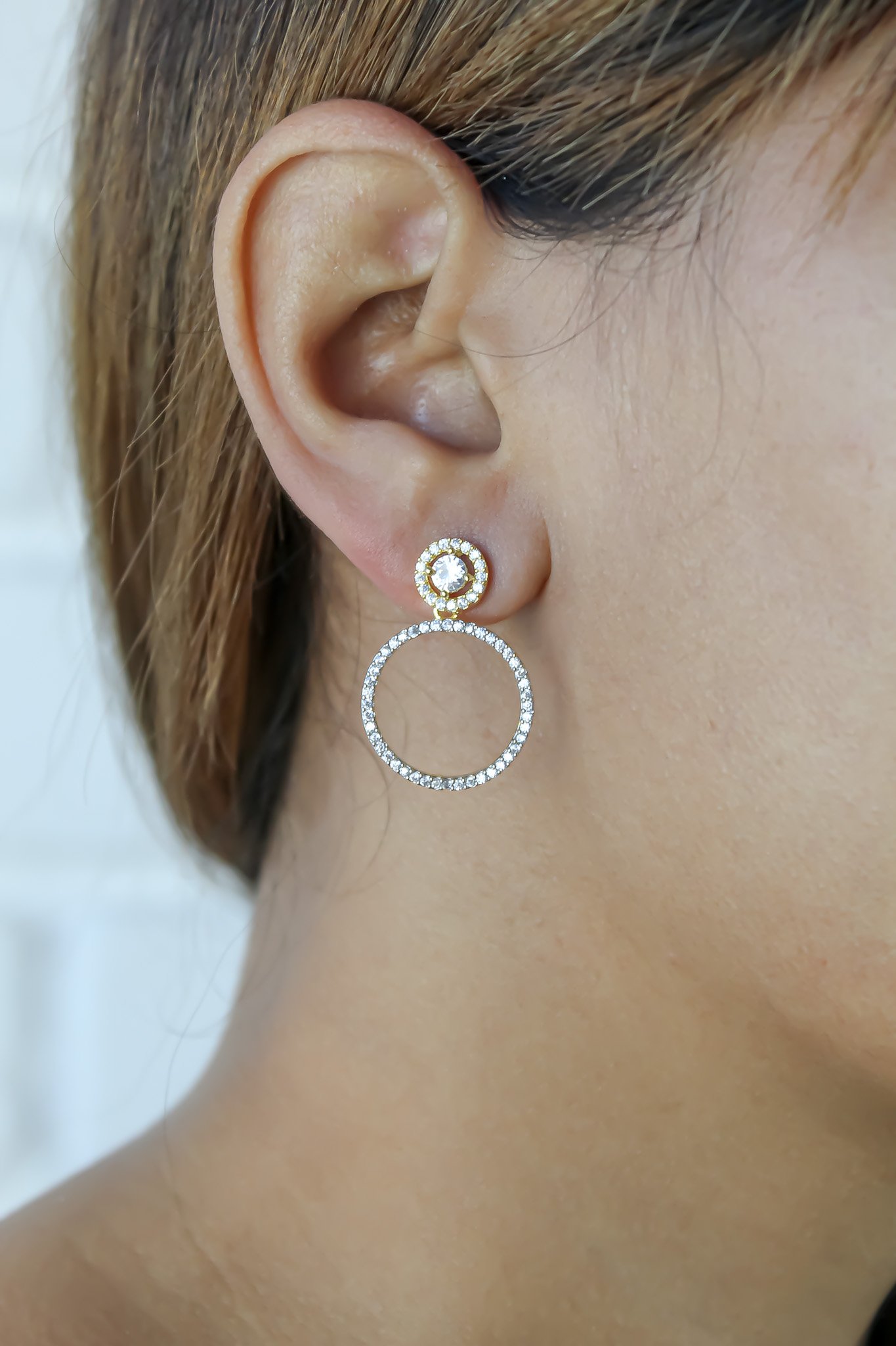 Hypnosis Wave Earrings featuring 18K gold plating and sparkling zircon, showcasing a unique wave design.