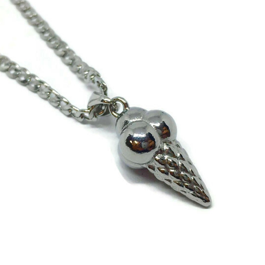 A stylish stainless steel necklace featuring a whimsical ice cream cone pendant, perfect for adding a playful touch to any outfit.