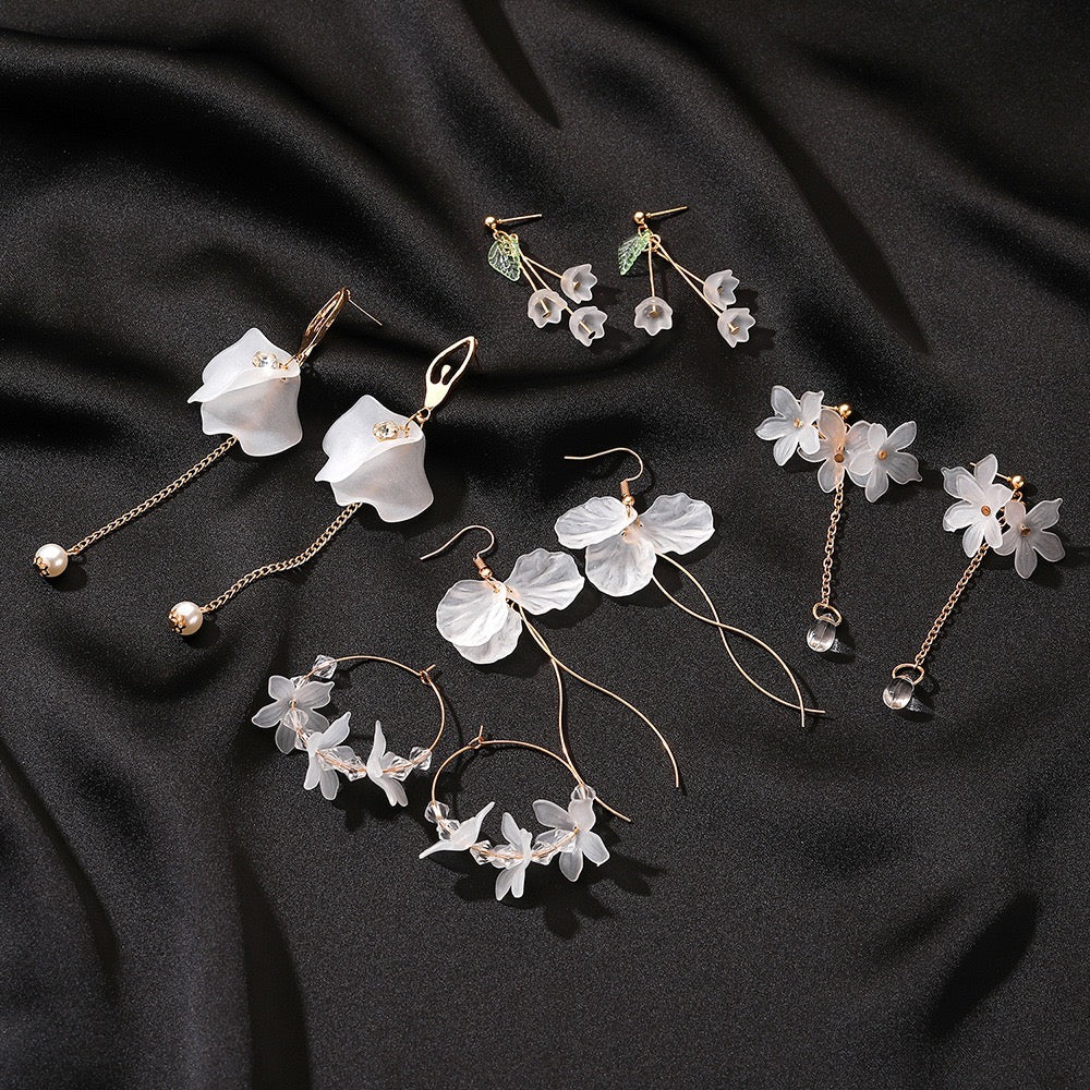 A pair of elegant Ice Flower Pedals Earrings featuring a unique curly string design, crafted from alloy and plastic, showcasing delicate floral details.