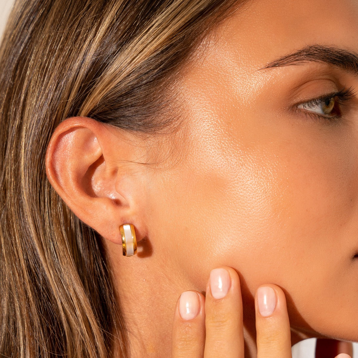 Elegant Ilham Shell Stud Earrings in gold, crafted from premium stainless steel with a luxurious finish.