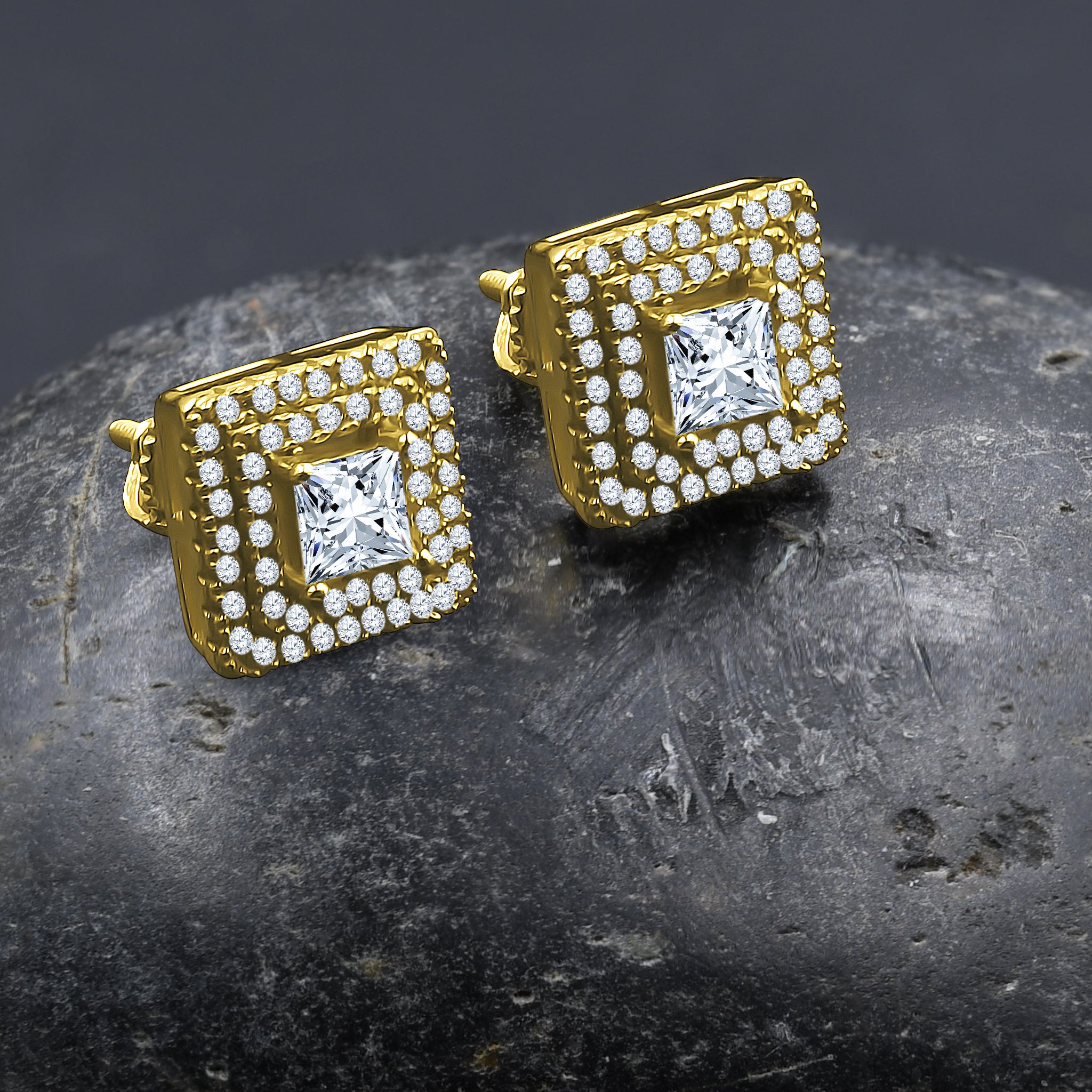 A pair of Incandescent Screw Back earrings featuring a central cubic zirconia stone surrounded by smaller stones in a square design, crafted from brass copper metal.