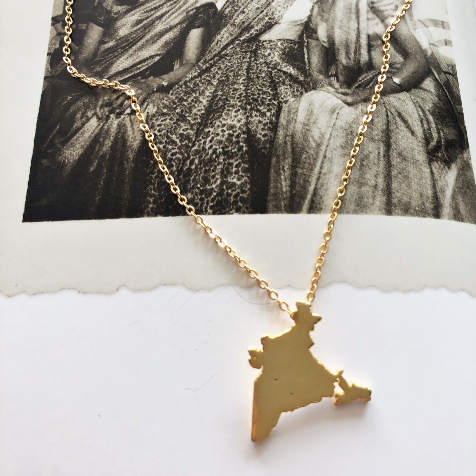 India Unity Pendant featuring 18K gold plating on a brass base, with a 17-inch chain and 2-inch extender.