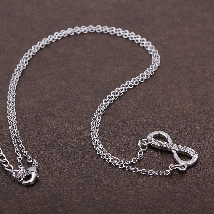 Infinity Design Micro-Pav'e White Gold Necklace featuring white crystals on a delicate link chain.