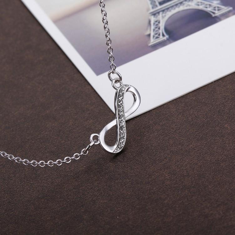 Infinity Design Micro-Pav'e White Gold Necklace featuring white crystals on a delicate link chain.