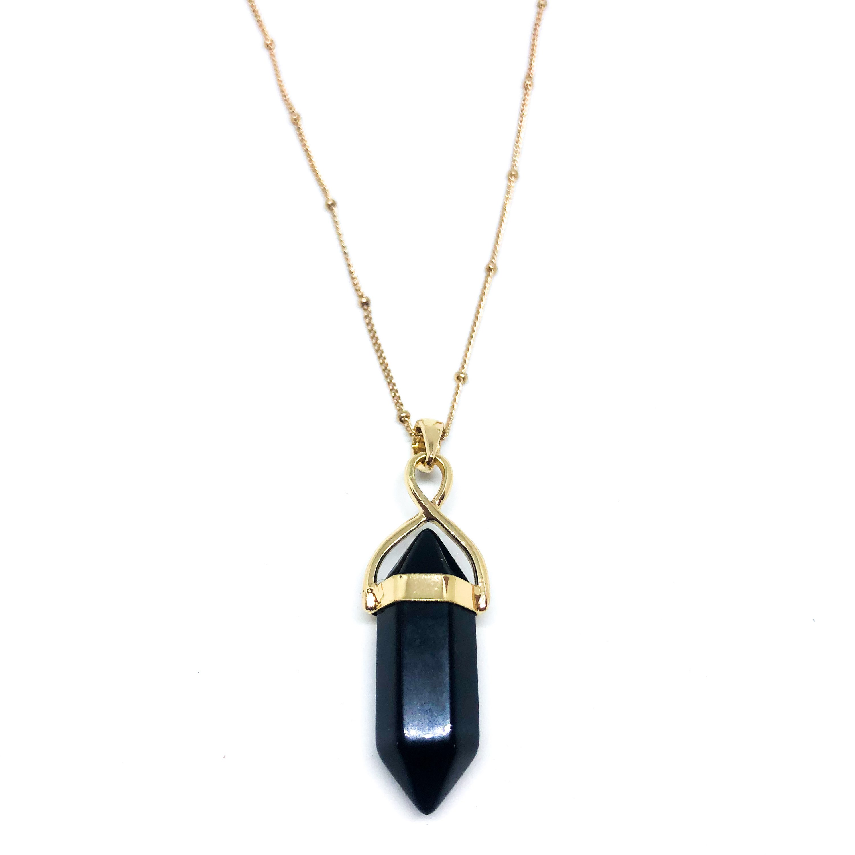 A long gemstone point necklace available in gold or silver plating, showcasing its elegant design and versatility.