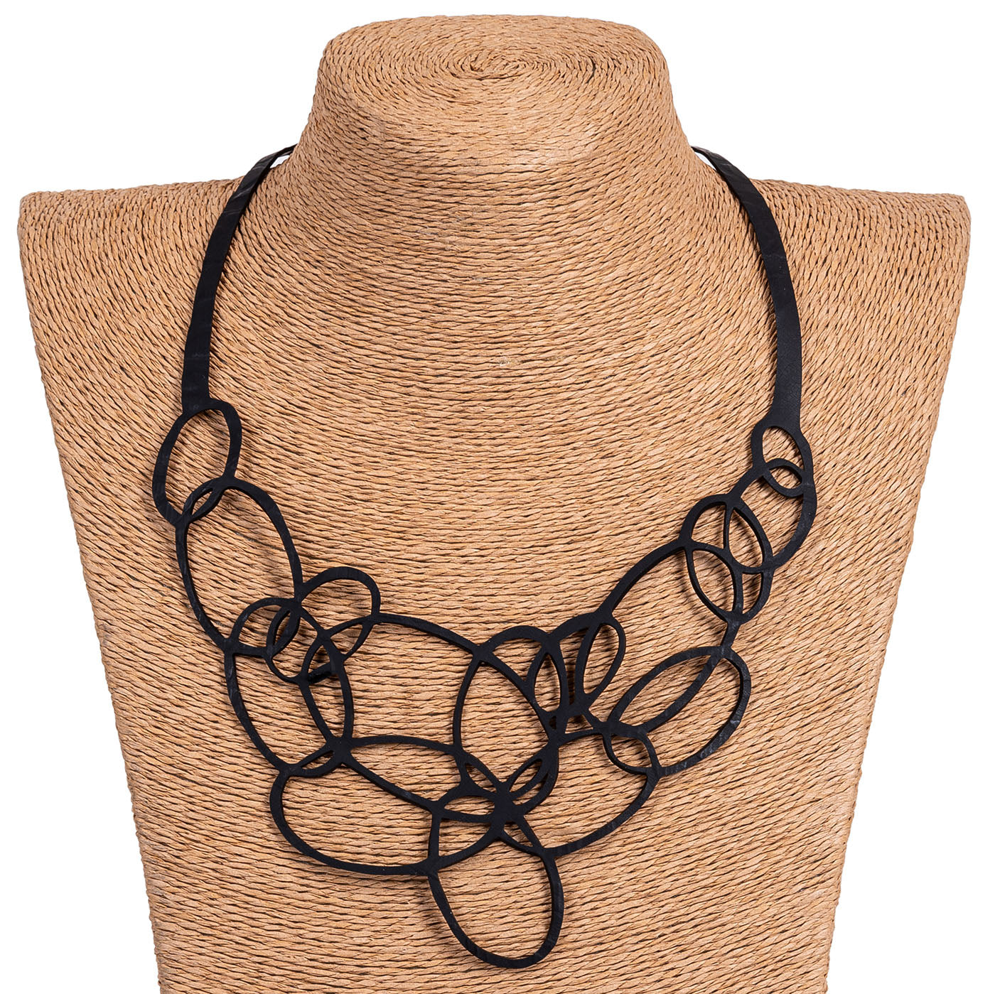 Elegant Infinity Upcycled Inner Tube Necklace made from reclaimed rubber, showcasing unique patterns and textures.