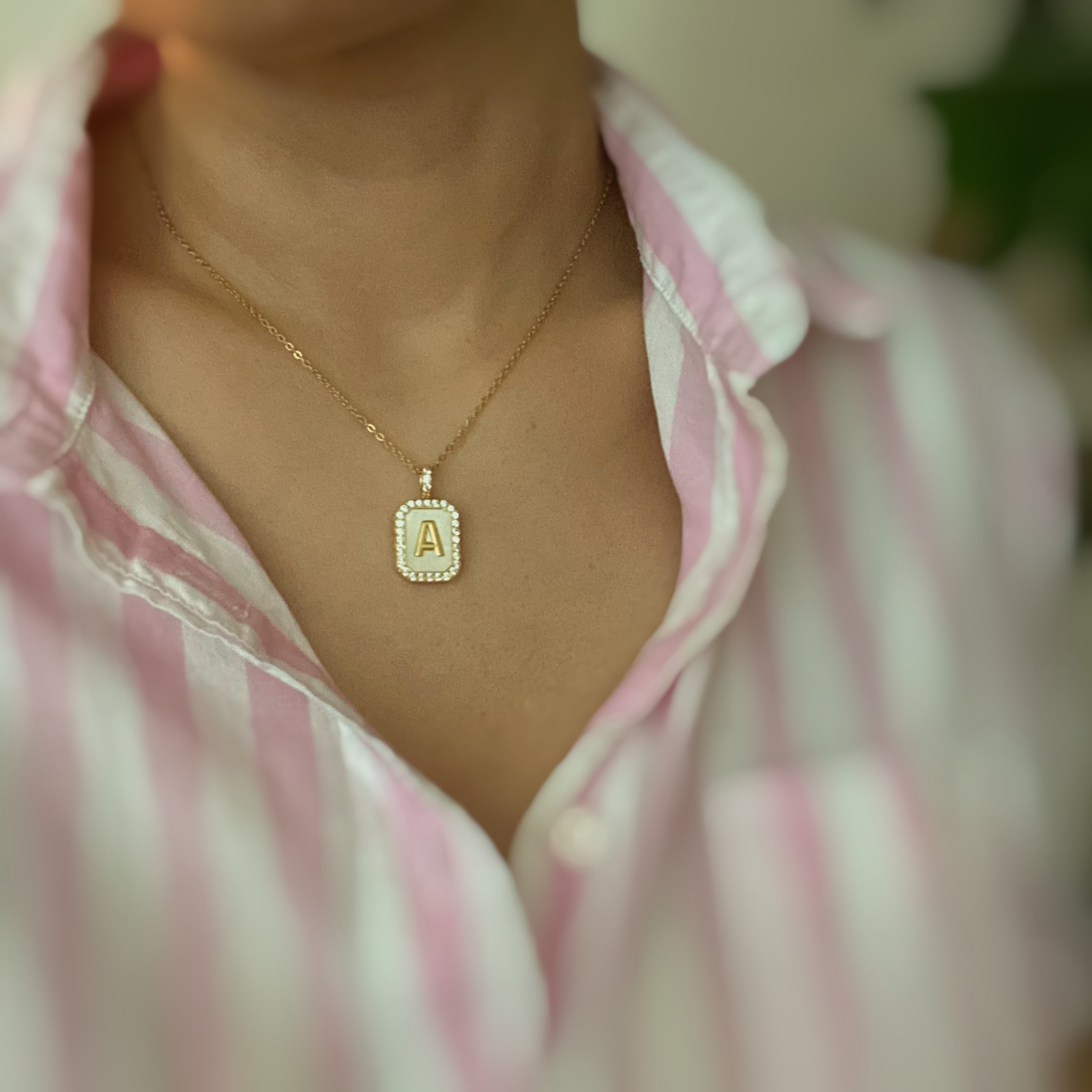 Initial Deco Open Locket Pendant Necklace featuring mother of pearl and cubic zirconia, octagon shape with customizable initial.